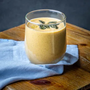 Glass of pumpkin smoothie close view