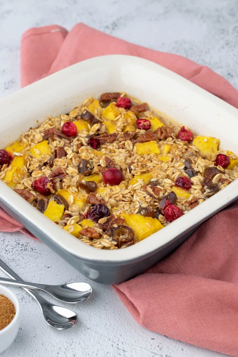 baked oatmeal in tray with spoons