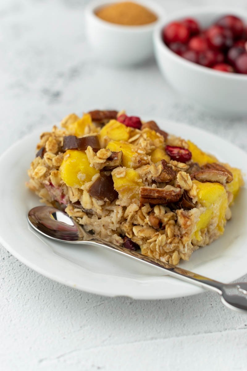 baked oatmeal on a white plate close view